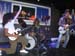 0.0.2.4 Alex an der E-Gitarre und Manuel am Schlagzeug. Beide mit Rocker-Perrücke. Ach ja, ganz rechts, der Peter Maffay